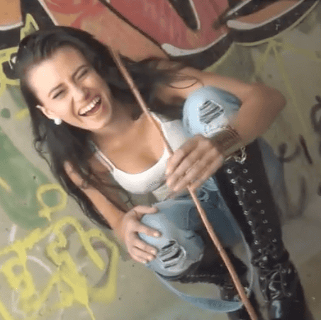 girl smiling in balck boots
