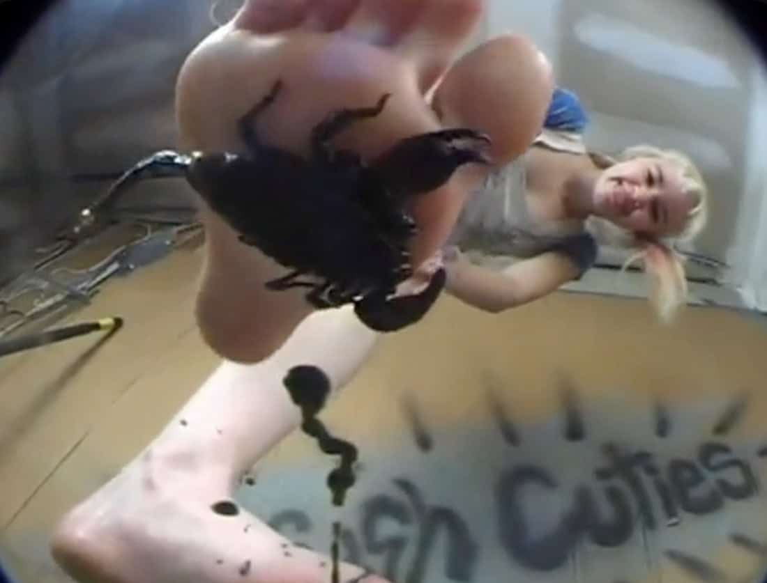 barefoot underglass foot over scorpion
